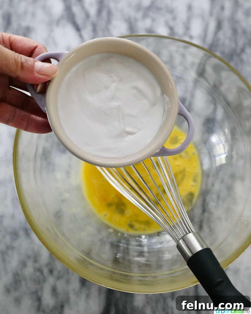 Adding sour cream to eggs