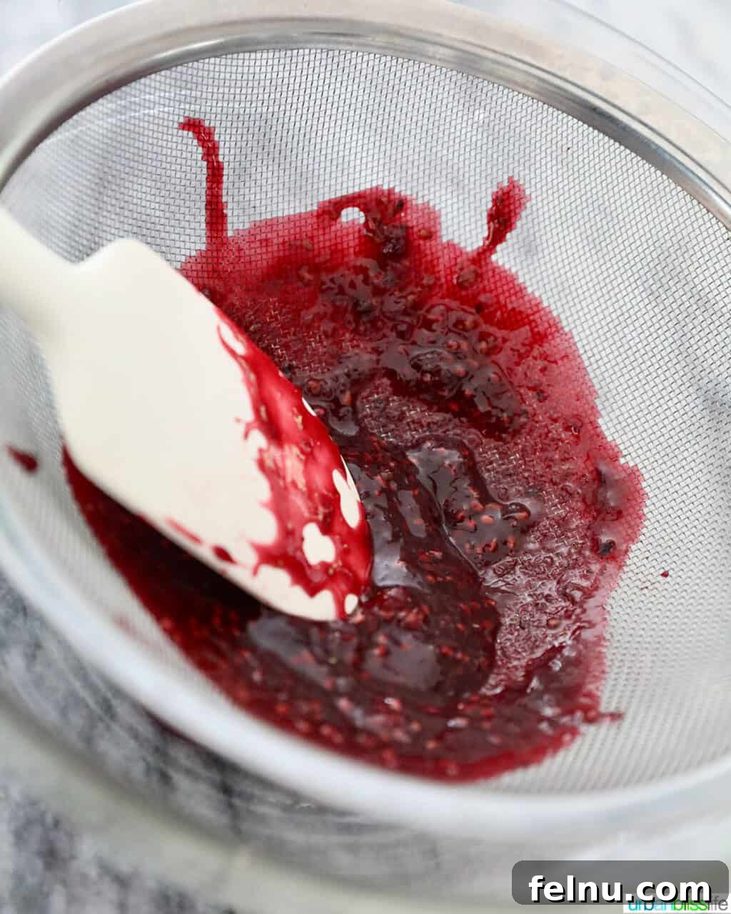 Straining blackberries
