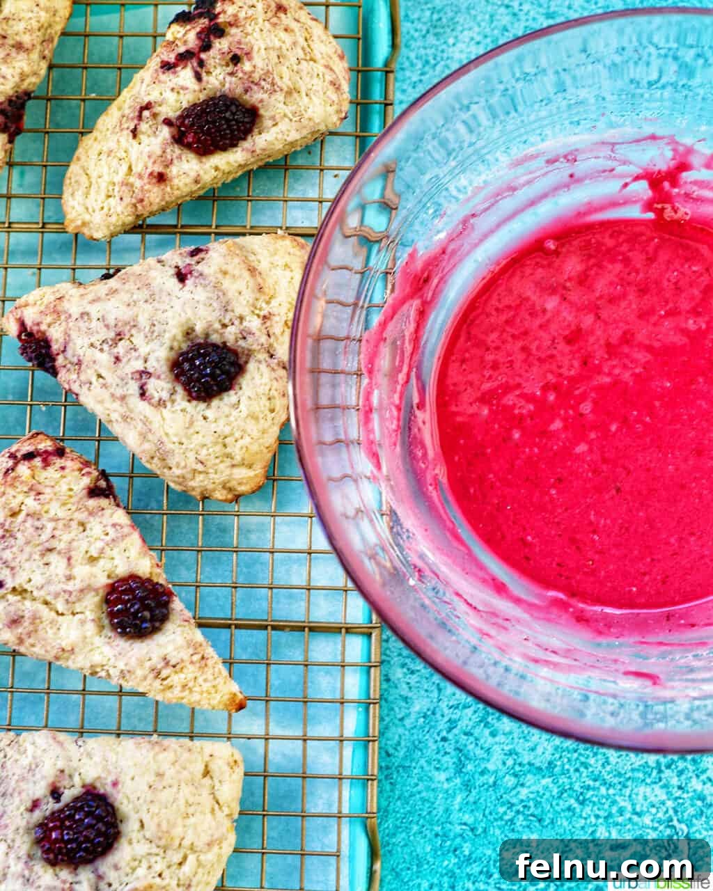 Blackberry scones with a bowl of blackberry glaze