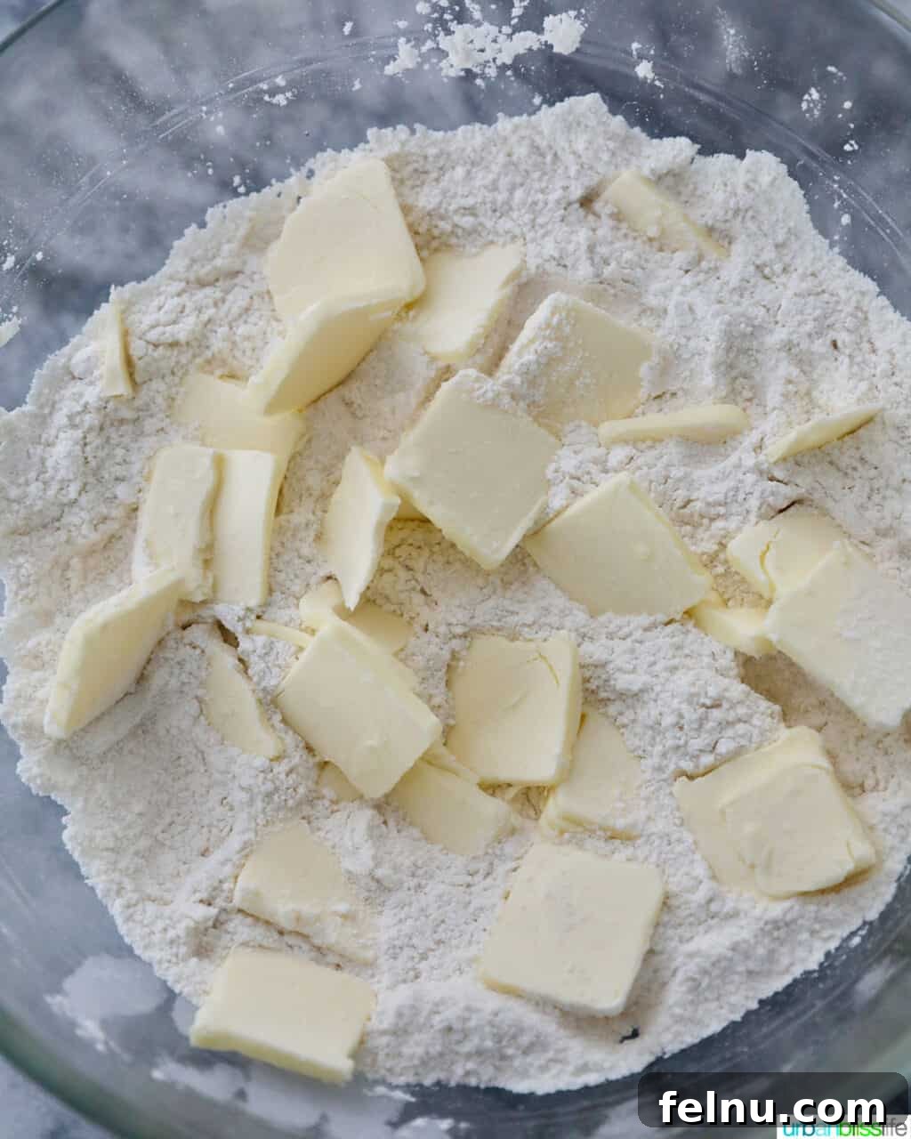 Sliced butter into flour