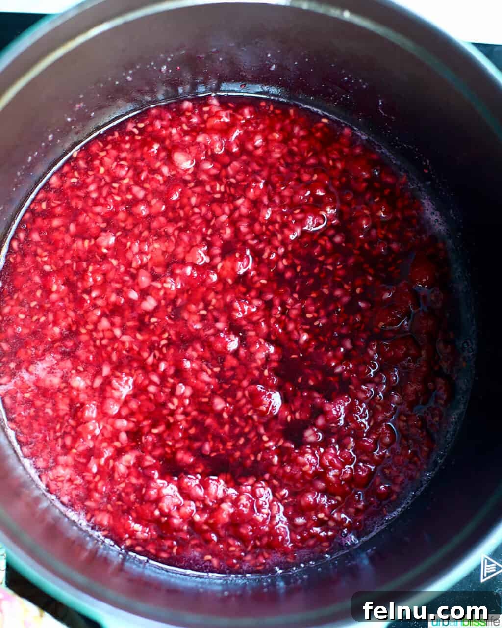 Raspberry Sparklers 10 Close-up of the vibrant, unstrained raspberry syrup simmering in the pot.