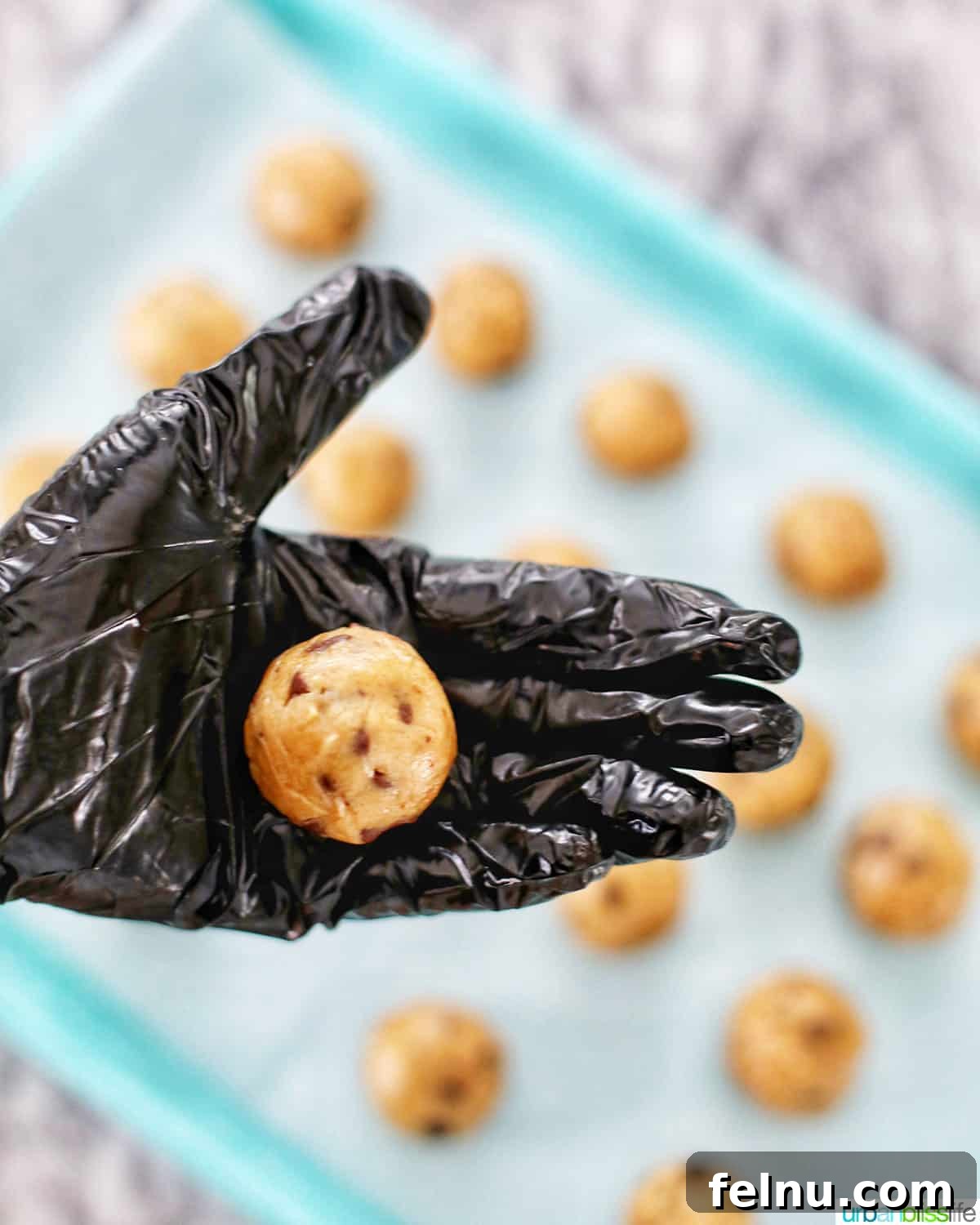 Decadent Cookie Dough Delights 7 rolled edible cookie dough in hand