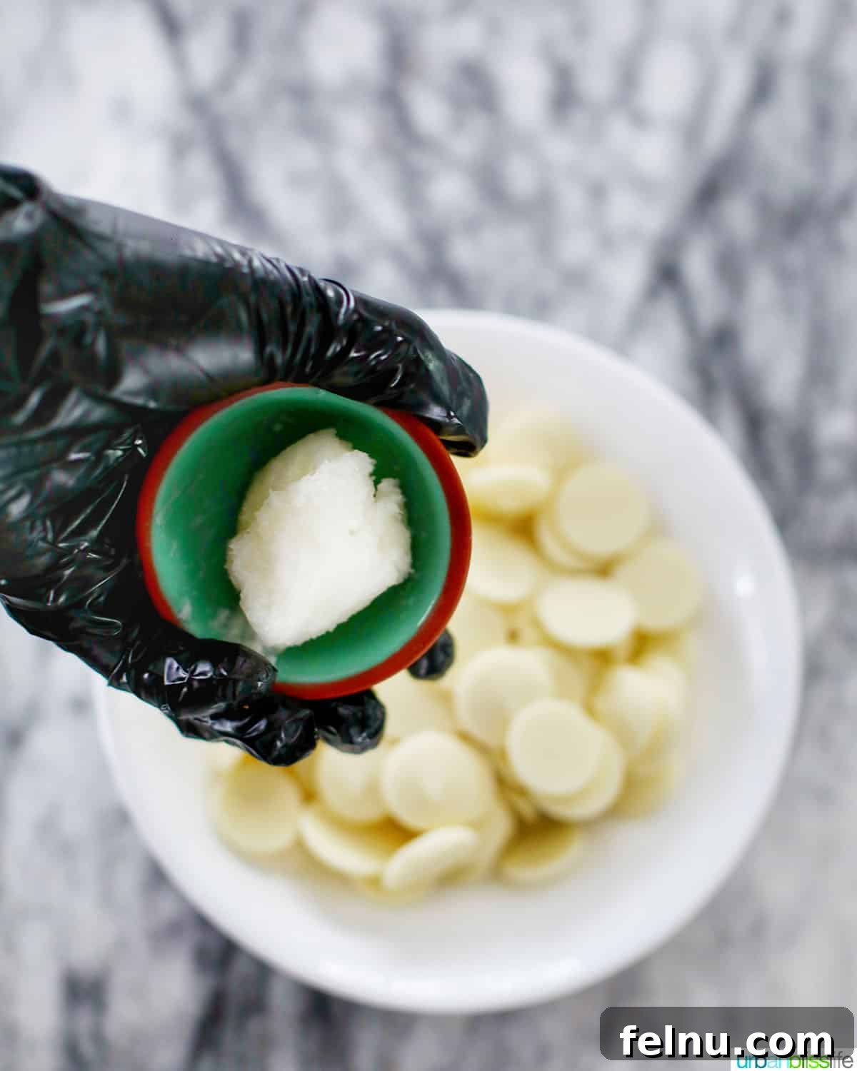 Decadent Cookie Dough Delights 9 adding coconut oil to white chocolate