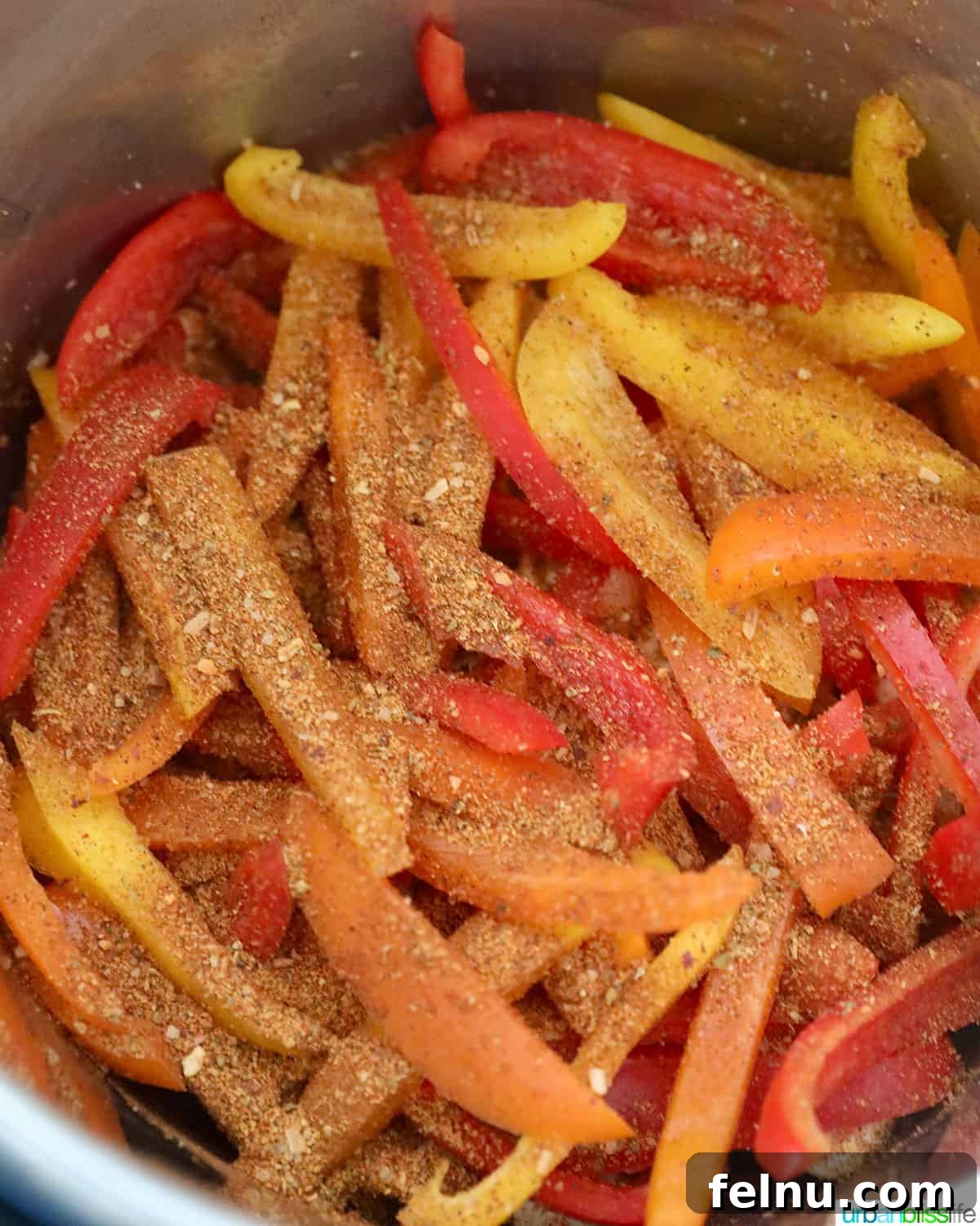 Sizzling Instant Pot Chicken Fajitas 12 Adding spices to peppers
