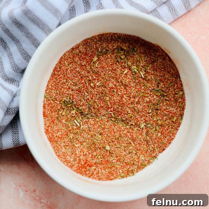 Mastering Homemade Cajun Flavor 7 homemade cajun seasoning in a white bowl.