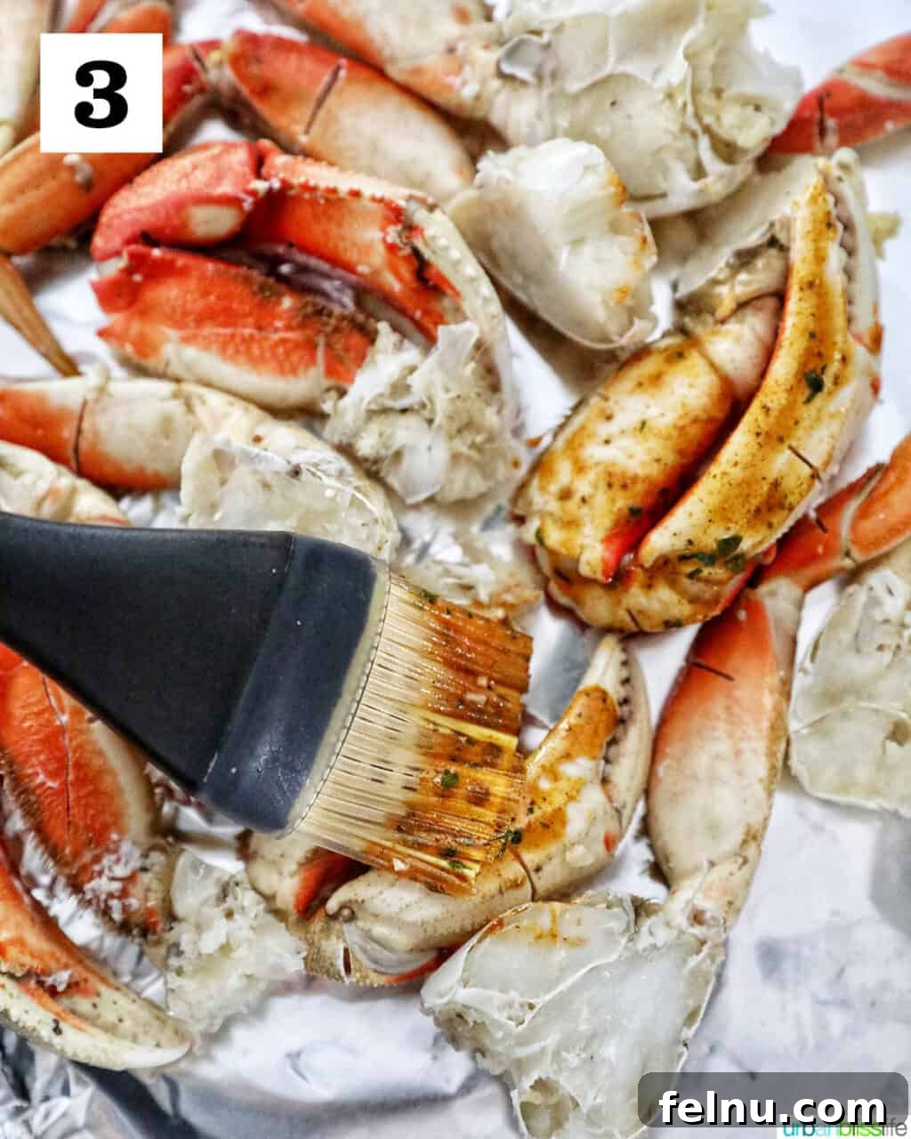 Air Fryer Crab Legs Delight 7 Brushing Sauce onto Crab Legs