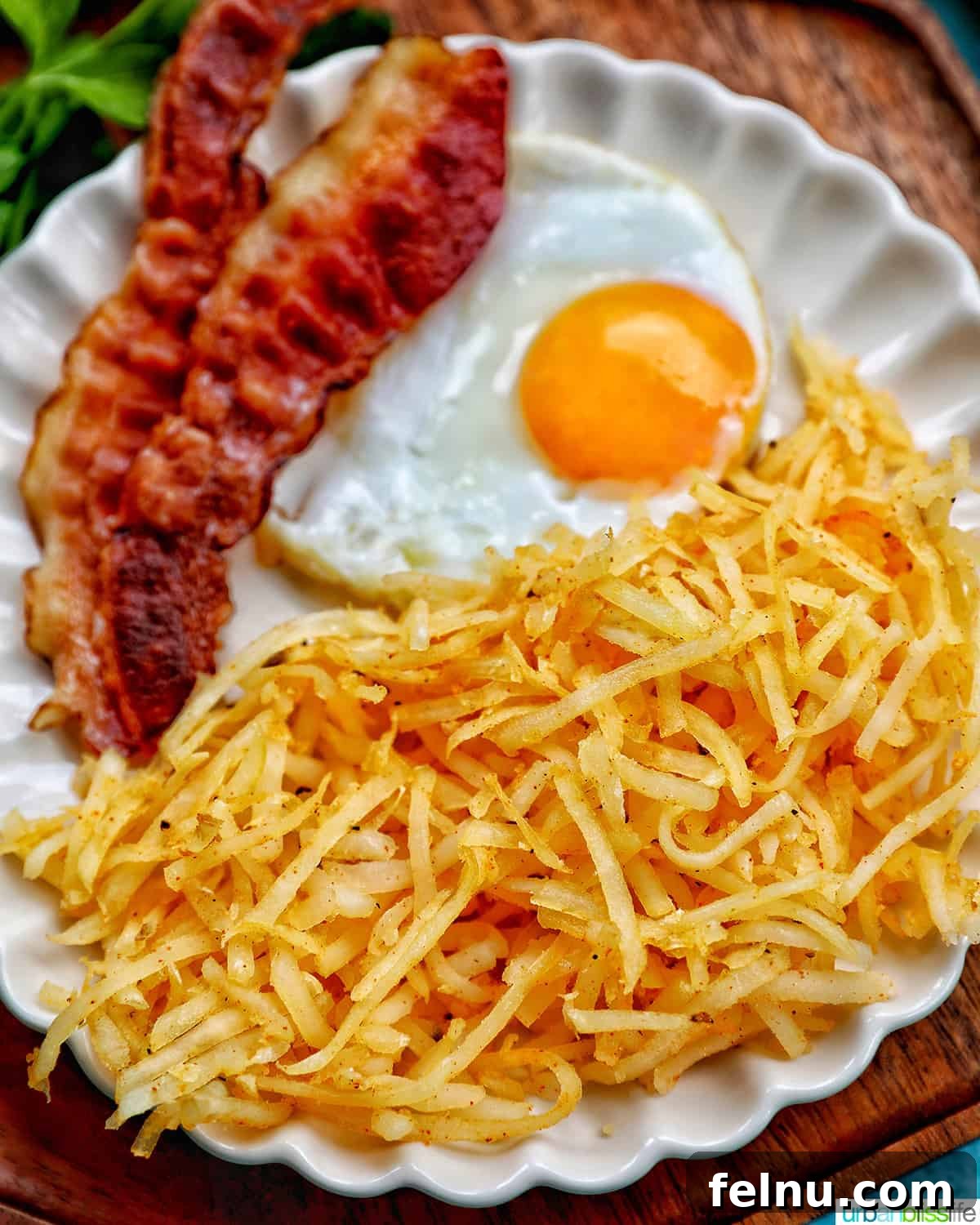 Air-Fried Hash Brown Bliss 11 Air fryer hash browns plated with bacon and eggs