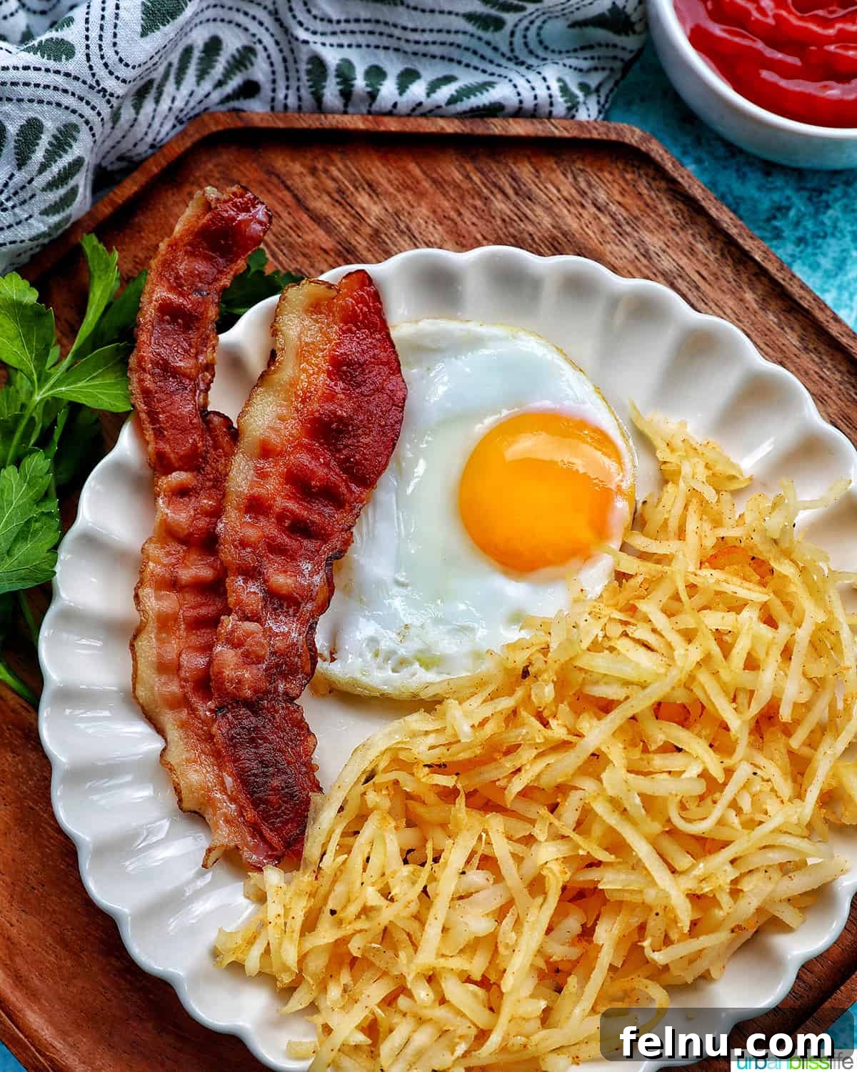 Air-Fried Hash Brown Bliss 3 Shredded Air Fryer Hash Browns served with bacon and eggs