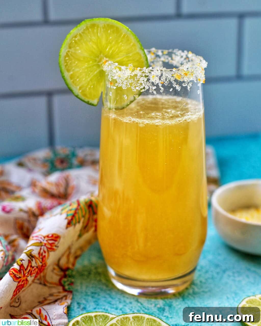 Sparkling Margarita Bliss 2 Glass of Champagne Margarita garnished with a lime slice