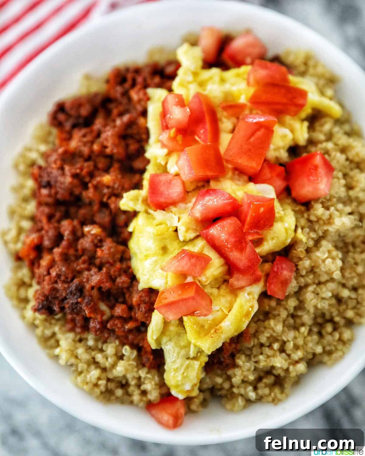 Chorizo breakfast bowl topped with tomatoes