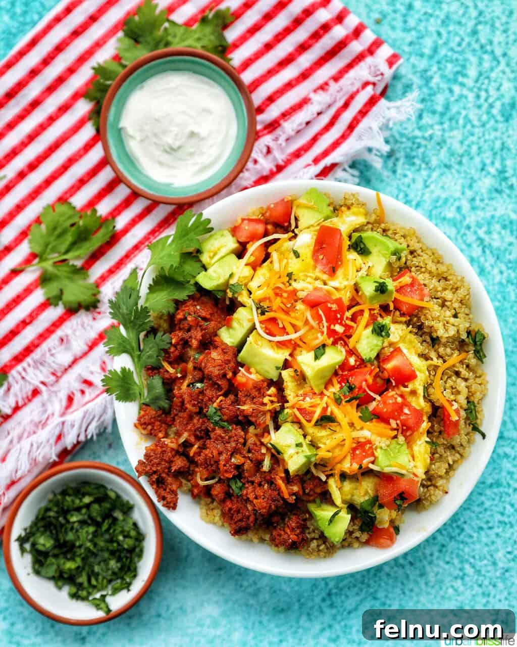 Chorizo Breakfast Bowl with sour cream and cilantro
