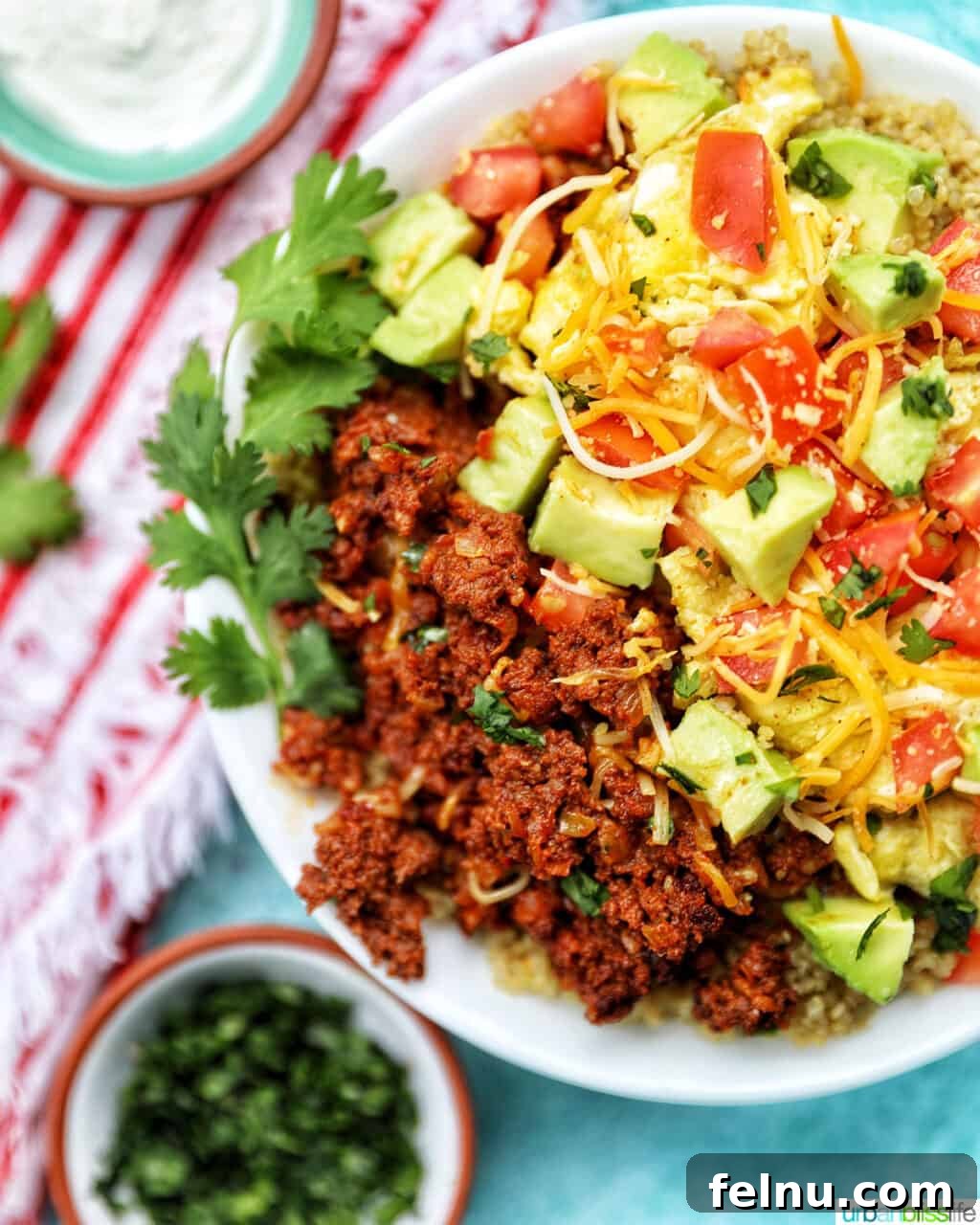 Close-up of a Chorizo Breakfast Bowl with sour cream and cilantro