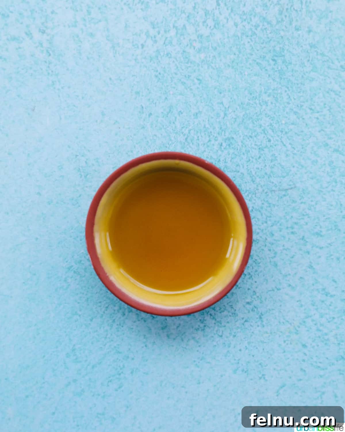 Adding olive oil to a skillet
