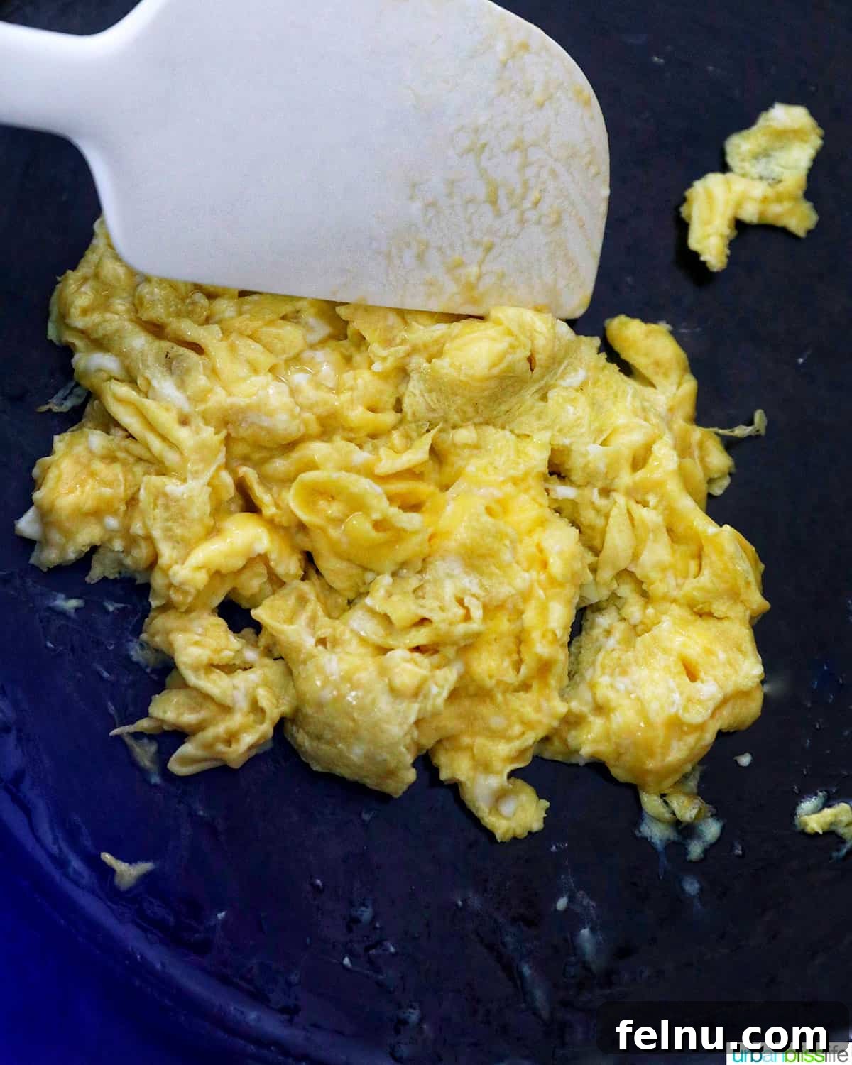 Scrambling eggs in a skillet