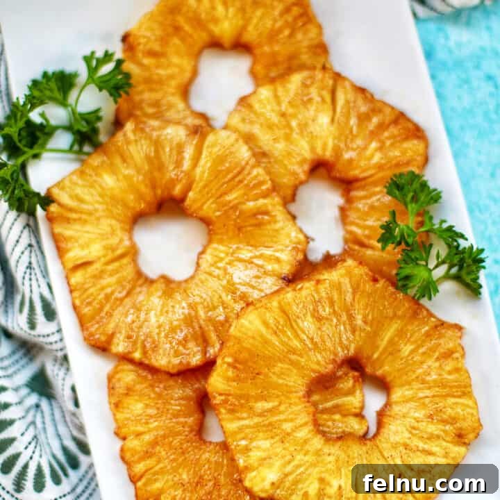 Close-up of golden brown air-fried pineapple slices