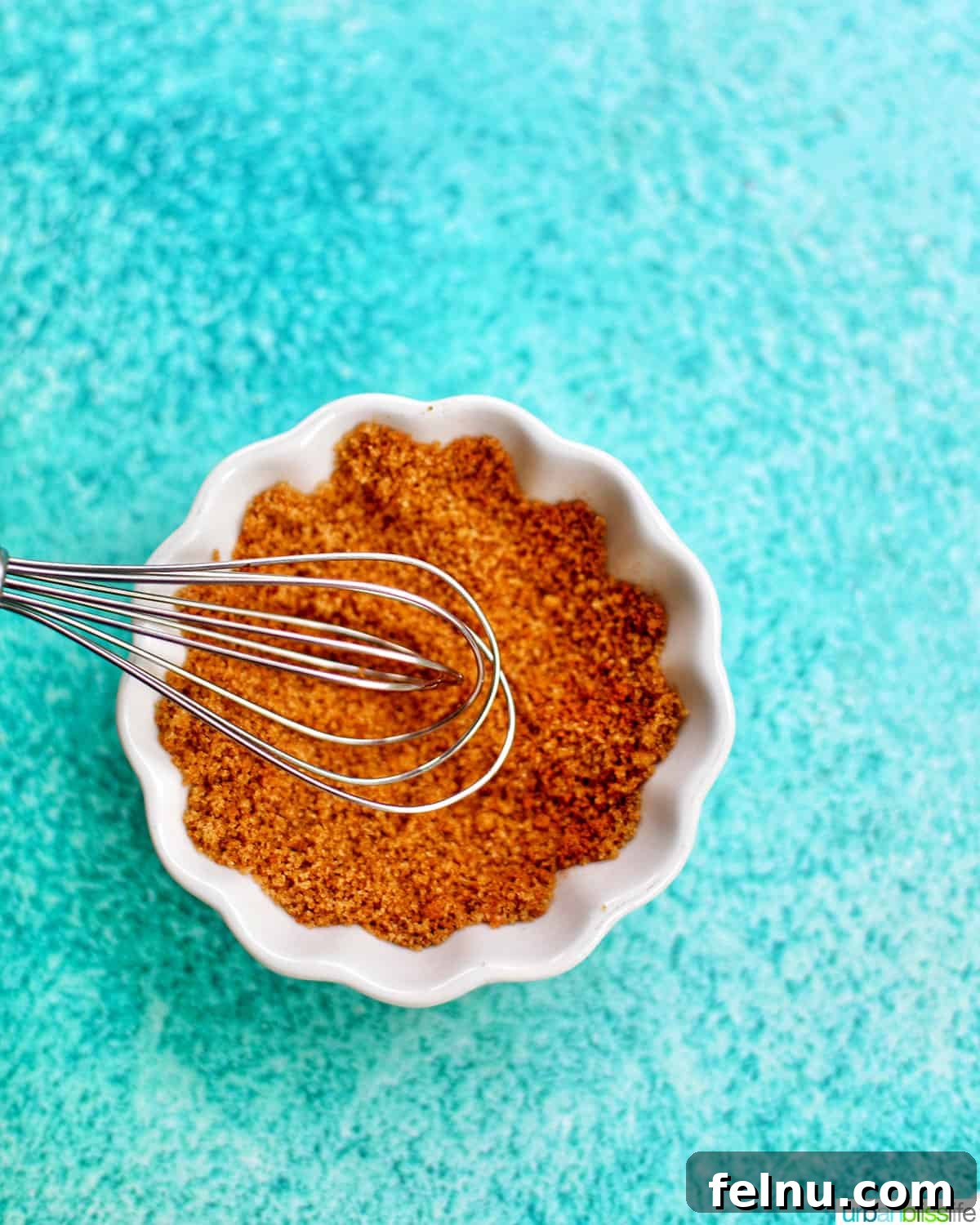 Golden Air Fryer Pineapple 5 Mixing brown sugar and ground cinnamon in a small bowl