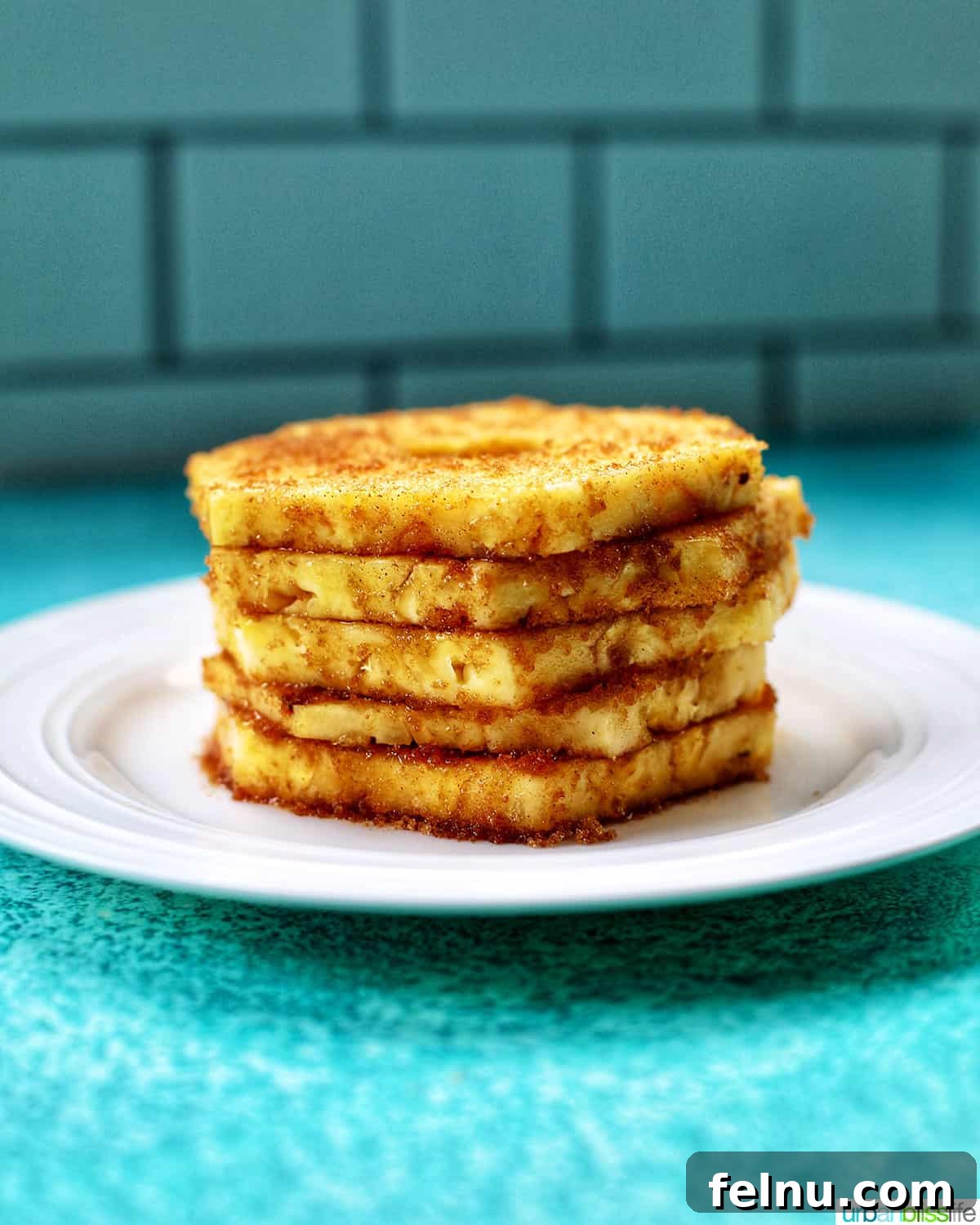 Golden Air Fryer Pineapple 8 Stack of golden brown air-fried pineapple slices
