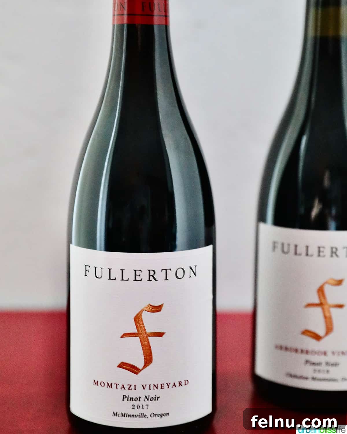 Fullerton Uncorked 5 A bottle of Fullerton Wines' 2017 Momtazi Vineyard Pinot Noir, showcasing its distinctive label and rich hue.