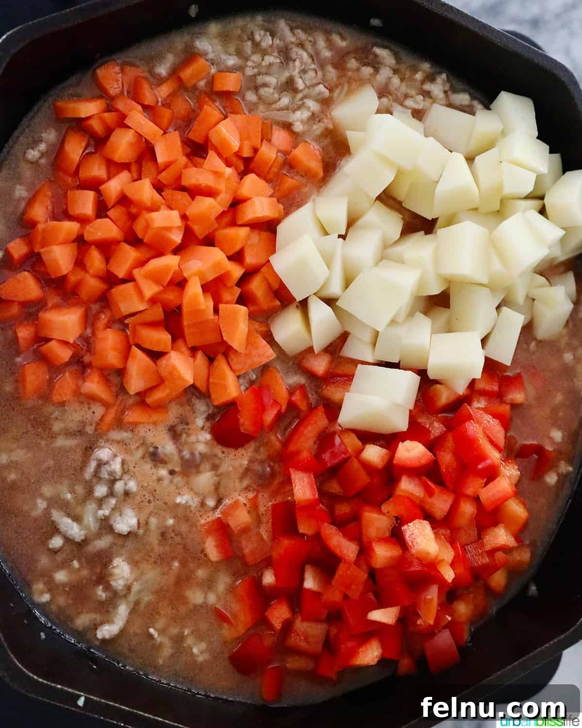 Ground Pork Menudo 6 Adding vegetables to menudo