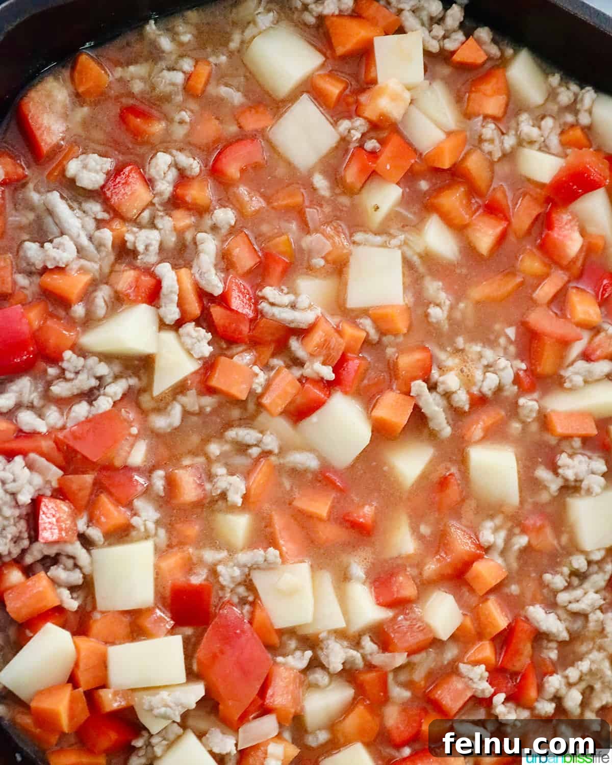 Ground Pork Menudo 7 Adding sauce to menudo
