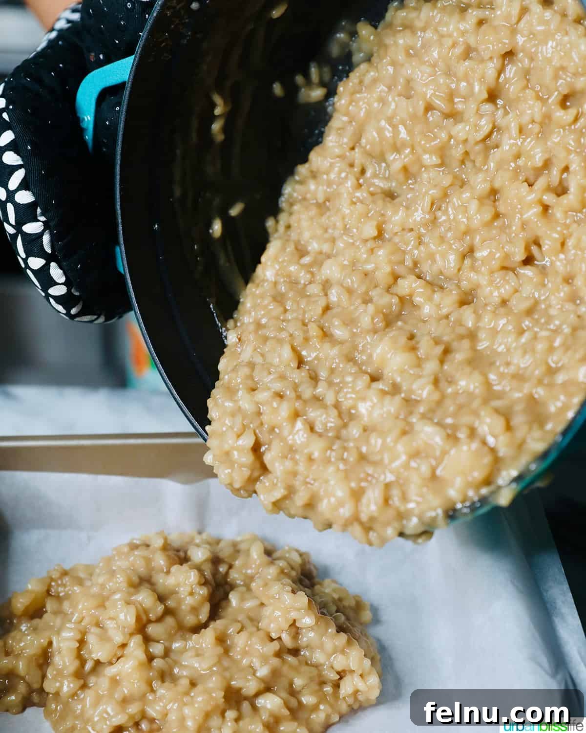 The Biko mixture being carefully poured into the prepared baking pan.