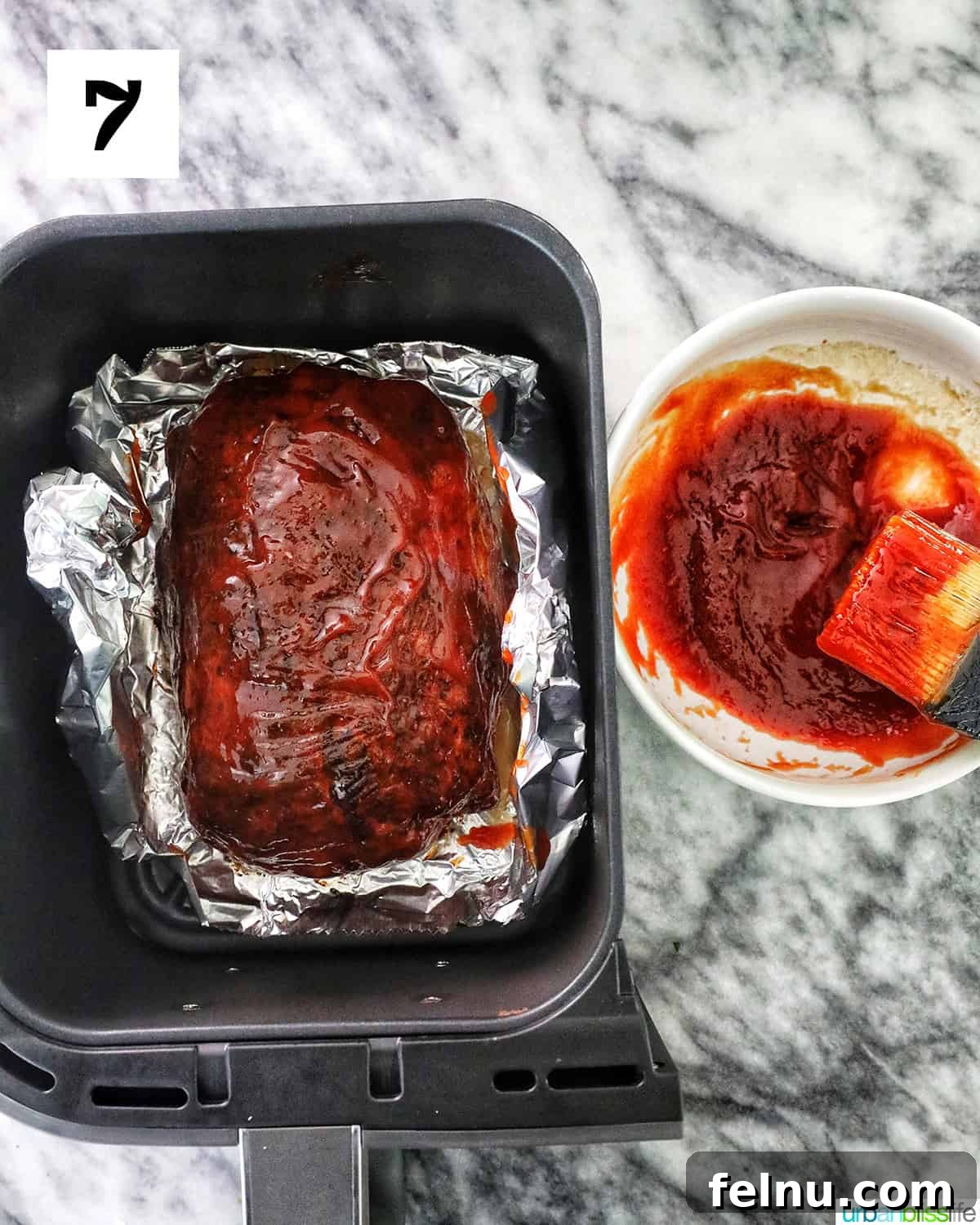 Air Fryer Meatloaf Magic 11 Applying glaze to meatloaf in air fryer