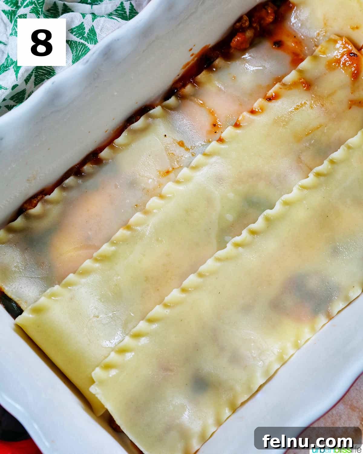 Creamy Vegan Lasagna 19 layer of cooked lasagna noodles added to a baking dish to make dairy free lasagna.