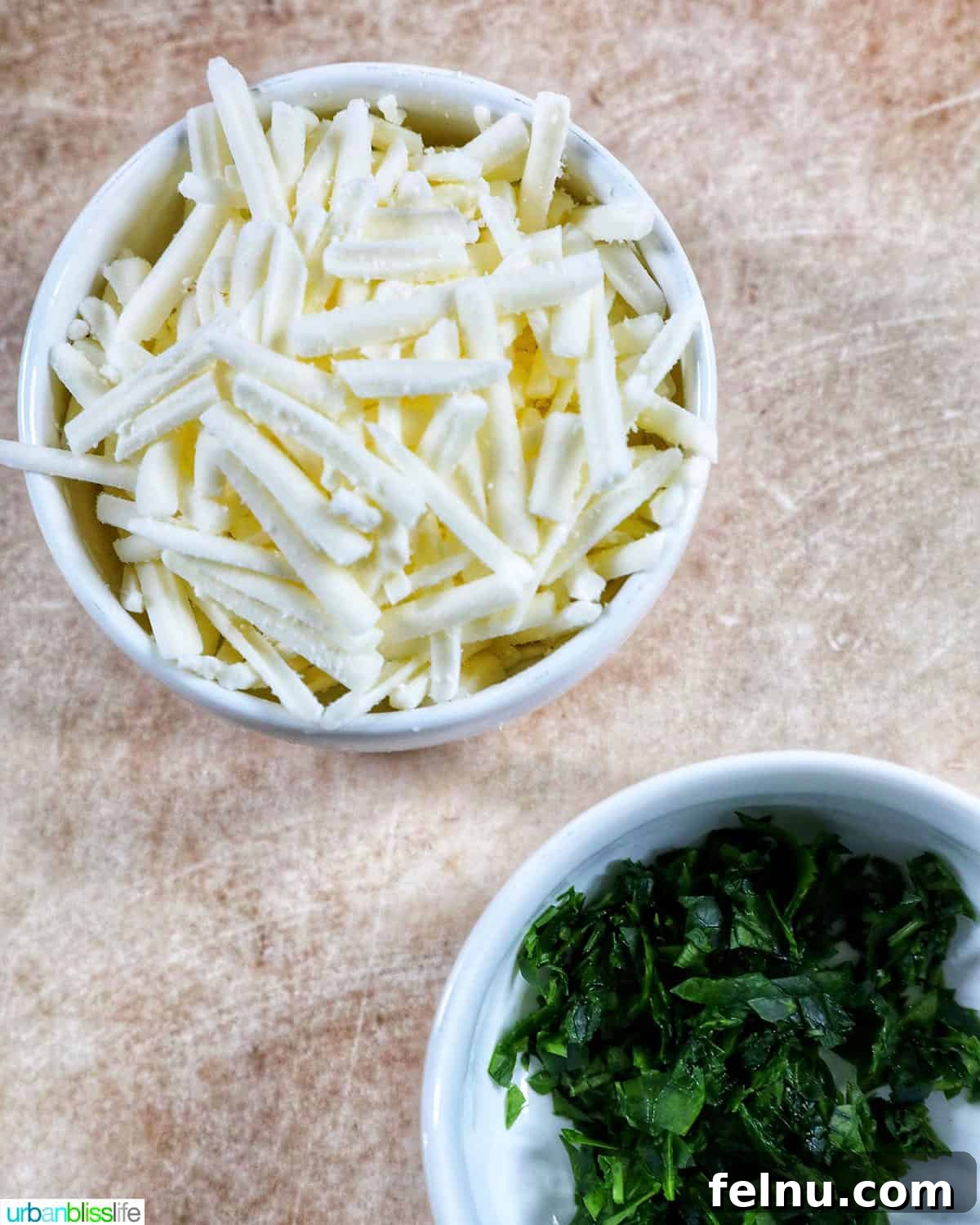 Creamy Vegan Lasagna 22 dairy-free cheese shreds and parsley on top of lasagna.