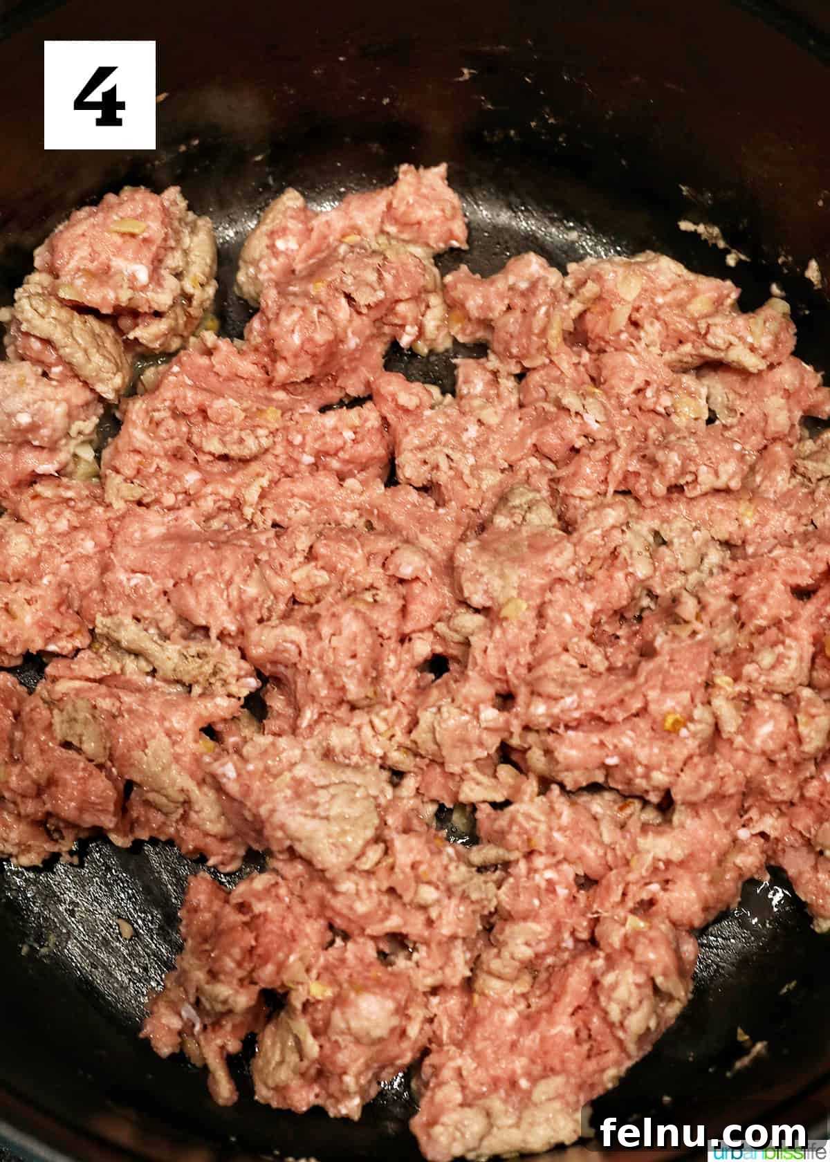 Creamy Vegan Lasagna 10 ground turkey cooking in a dutch oven.