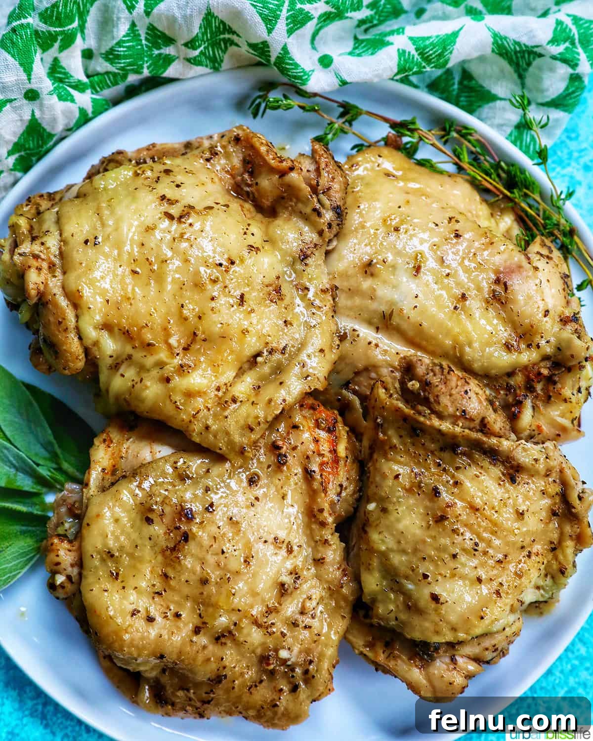 Instant Pot Chicken Thigh Recipe: Quick, Easy, and Delicious 16 Perfectly cooked Instant Pot Chicken Thighs on a white plate