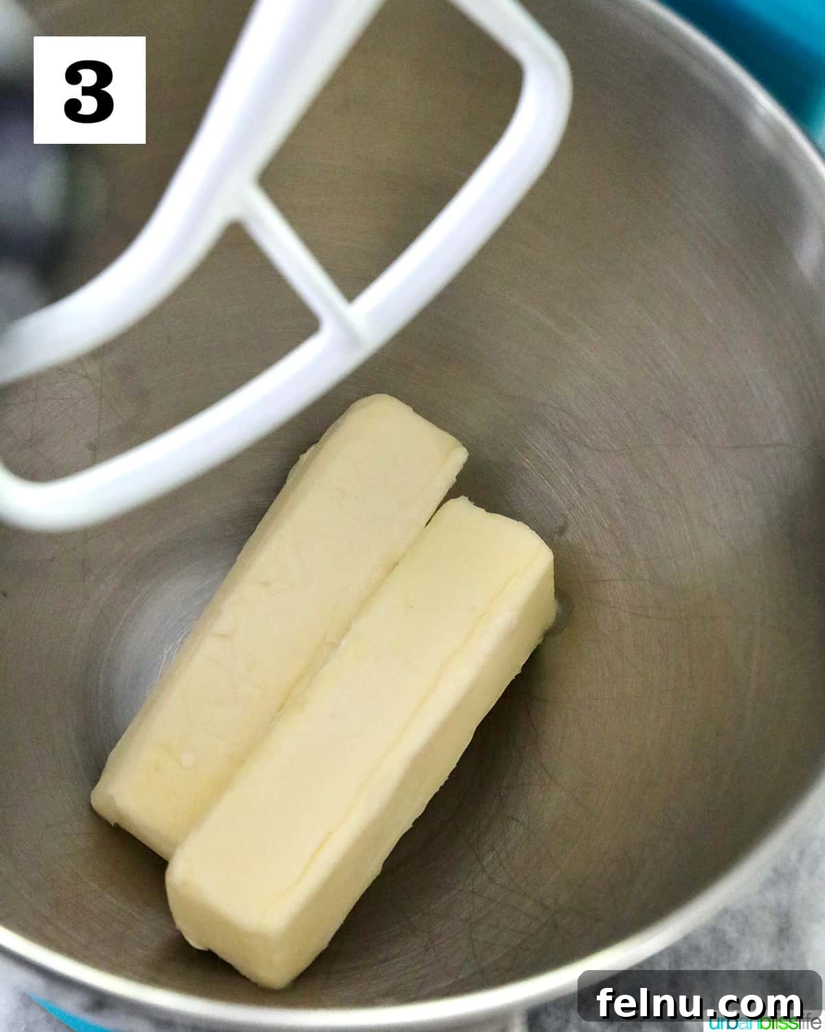 Tangy Key Lime Delights 9 Softened sticks of unsalted butter sitting inside the bowl of a stand mixer, ready for the creaming process.