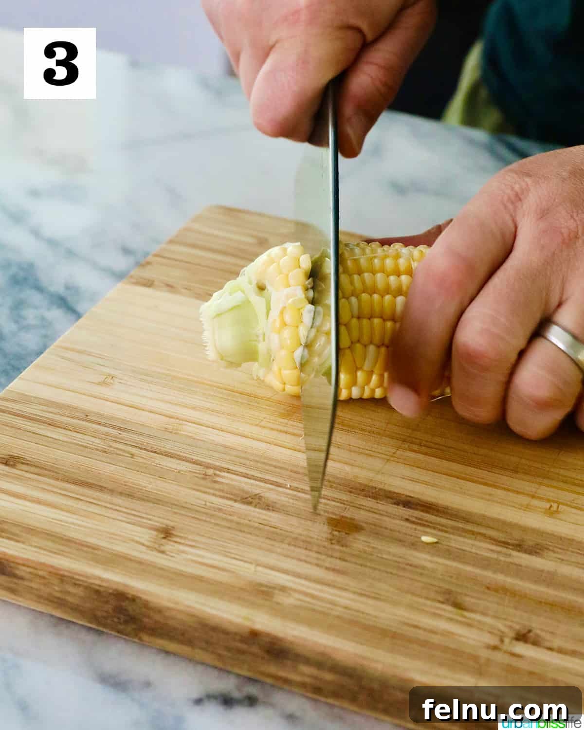 Air Fryer Corn "Ribs": A Crispy, Healthy Twist on a Classic 8 Slicing the end off a corn cob.
