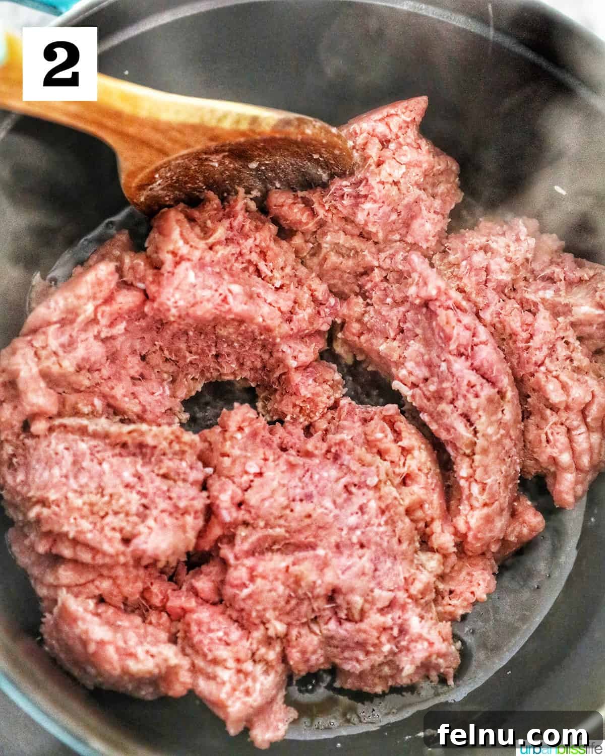 Creamy Dairy-Free Cheeseburger Mac Skillet 6 Ground turkey being cooked and browned in the same Dutch oven, breaking it up into small, even pieces.