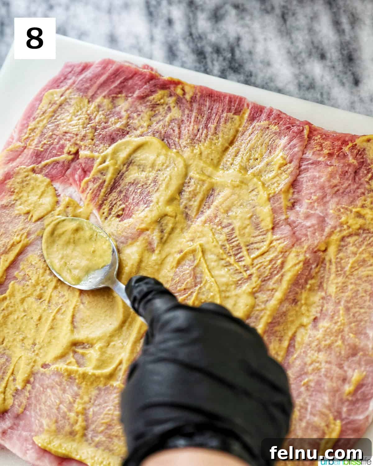 Instant Pot Pork Loin: A Flavorful One-Pot Wonder 13 Spreading mustard on the pork loin