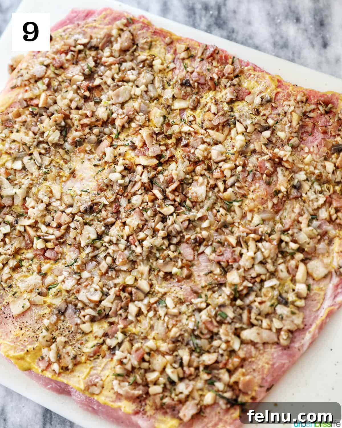 Instant Pot Pork Loin: A Flavorful One-Pot Wonder 14 Spreading mushroom mixture on the pork loin