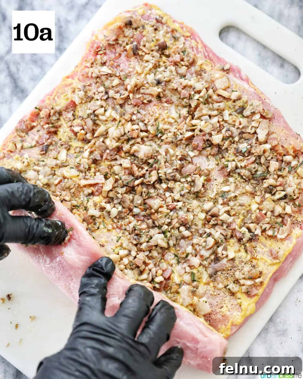 Instant Pot Pork Loin: A Flavorful One-Pot Wonder 15 Rolling up the stuffed pork loin