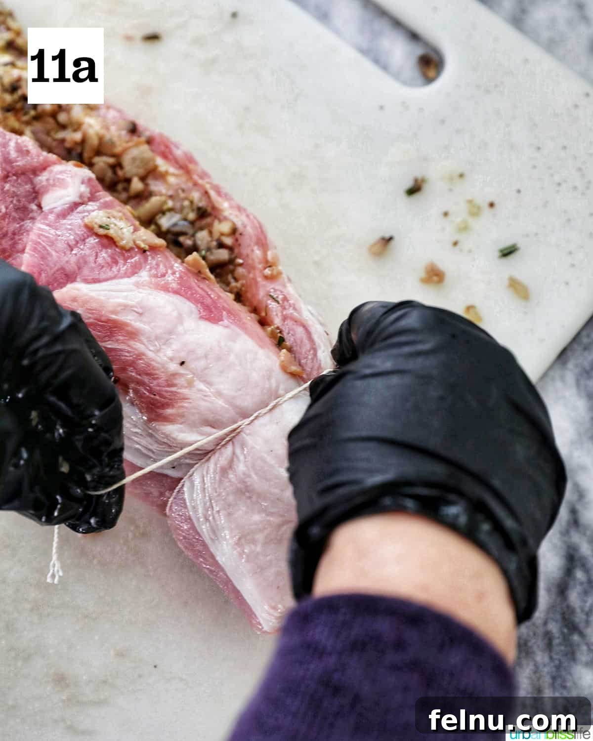 Instant Pot Pork Loin: A Flavorful One-Pot Wonder 17 Tying the pork loin with kitchen twine