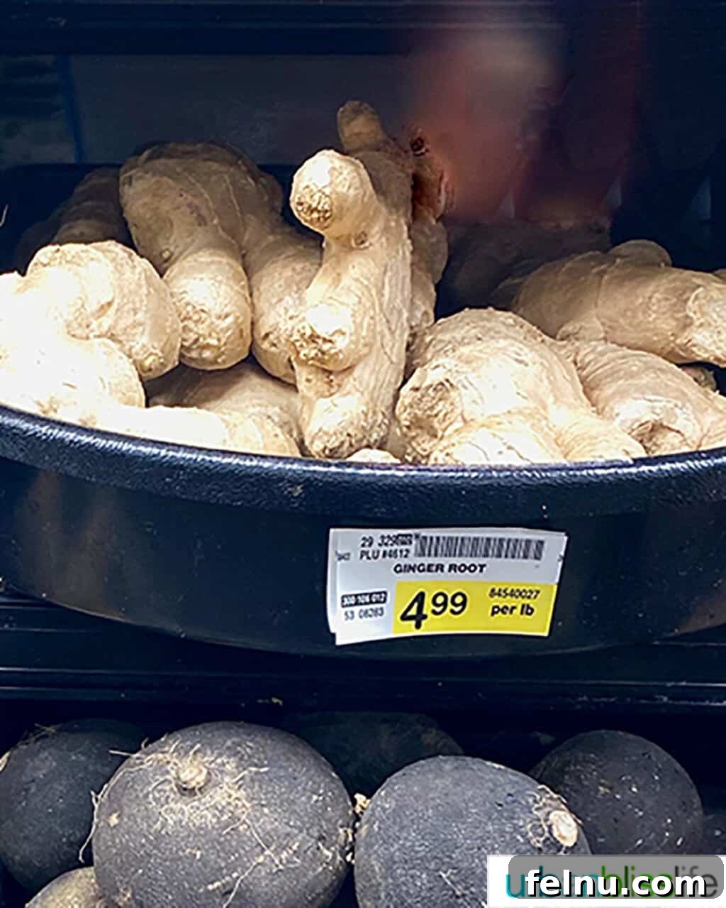 Building Your Essential Filipino Pantry 12 ginger root in a grocery store bin.