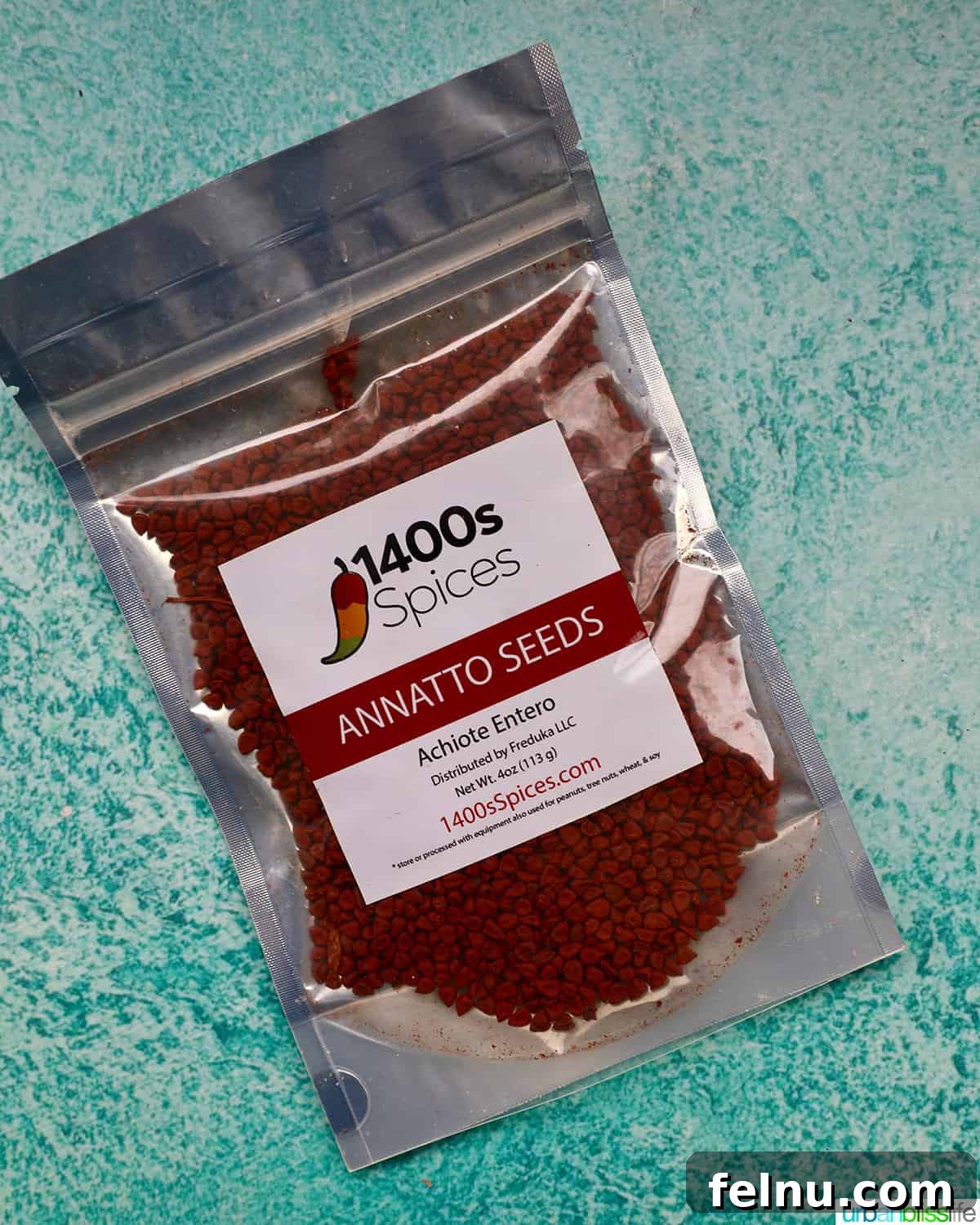 Building Your Essential Filipino Pantry 4 packet of annatto seeds on a blue background.
