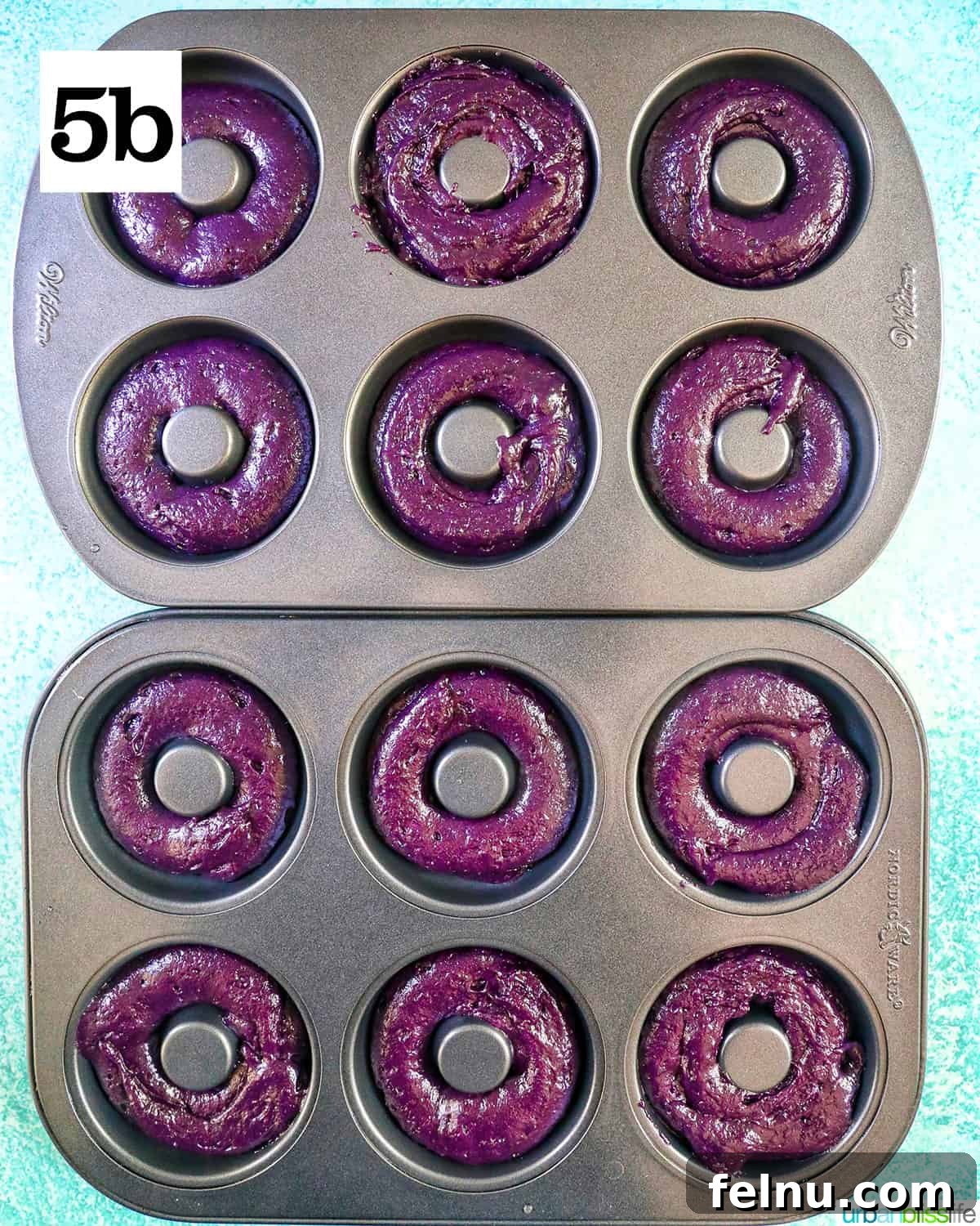 Ube Dream Donuts 12 Two donut pans filled with purple ube batter.