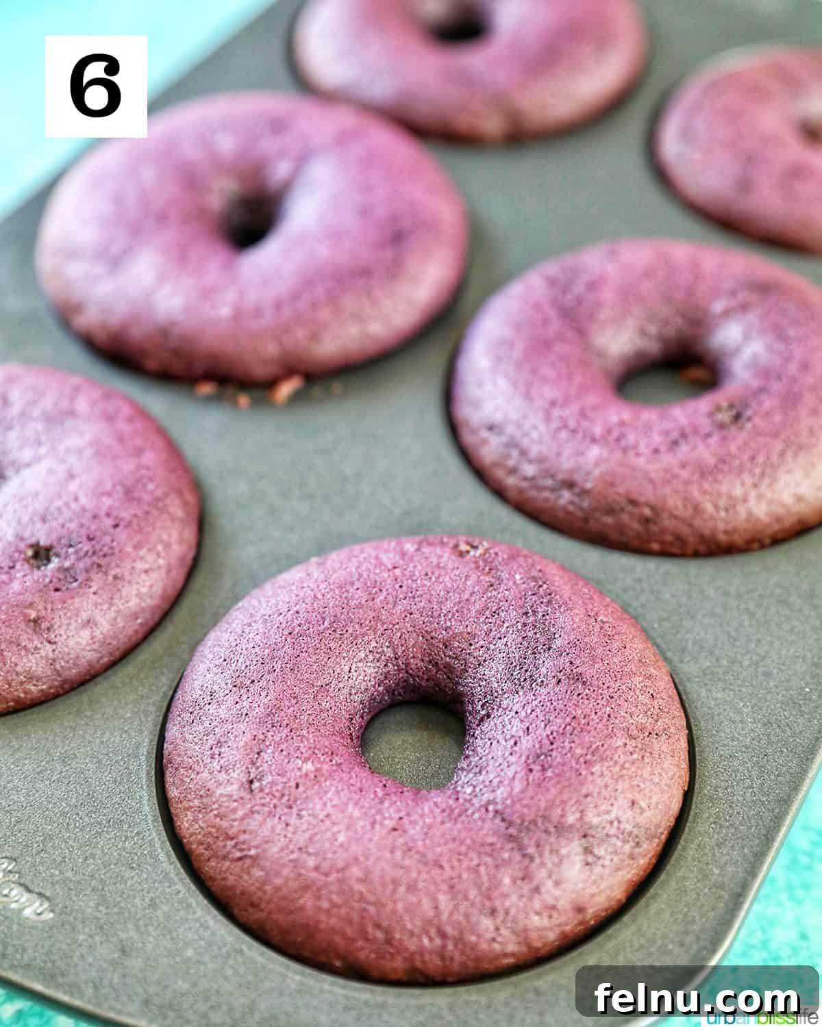 Ube Dream Donuts 13 Purple ube donuts baked in a donut pan.