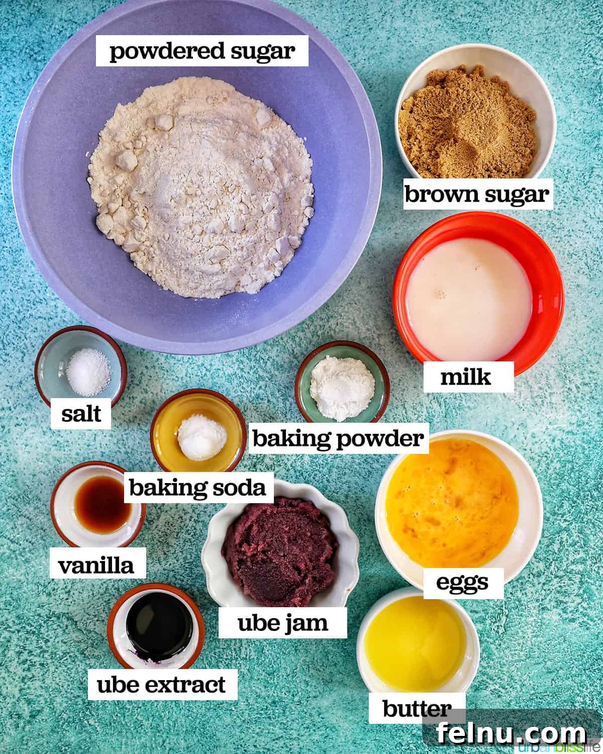 Ube Dream Donuts 4 An assortment of bowls containing the key ingredients for crafting delectable ube donuts, thoughtfully arranged on a charming blue table.