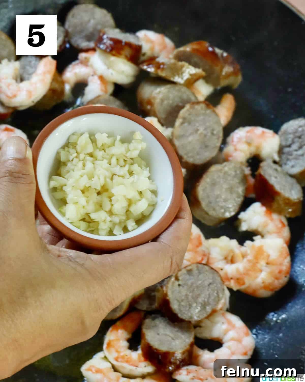 Savory Seafood & Sausage Skillet 9 Adding Garlic