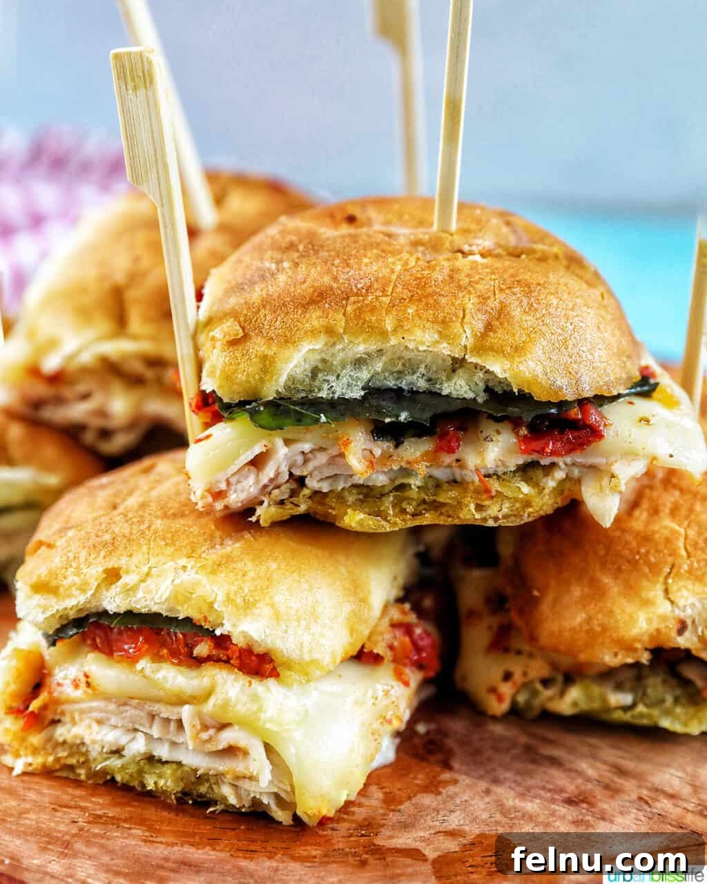 Turkey Pesto Sandwich sliders stacked on top of each other