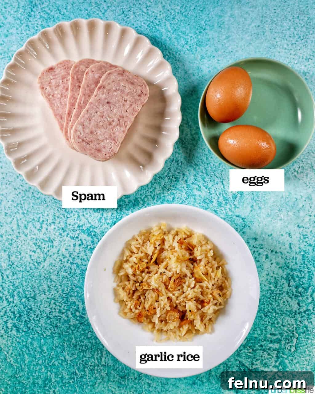 Spamsilog A Filipino Breakfast Classic 4 plates of spam, sinangag garlic rice, two eggs to make Filipino Spamsilog on a blue table.