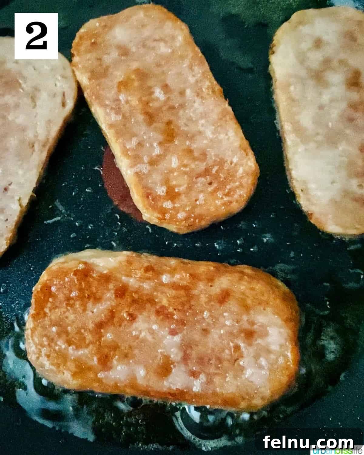 Spamsilog A Filipino Breakfast Classic 6 Spam slices frying in a nonstick skillet