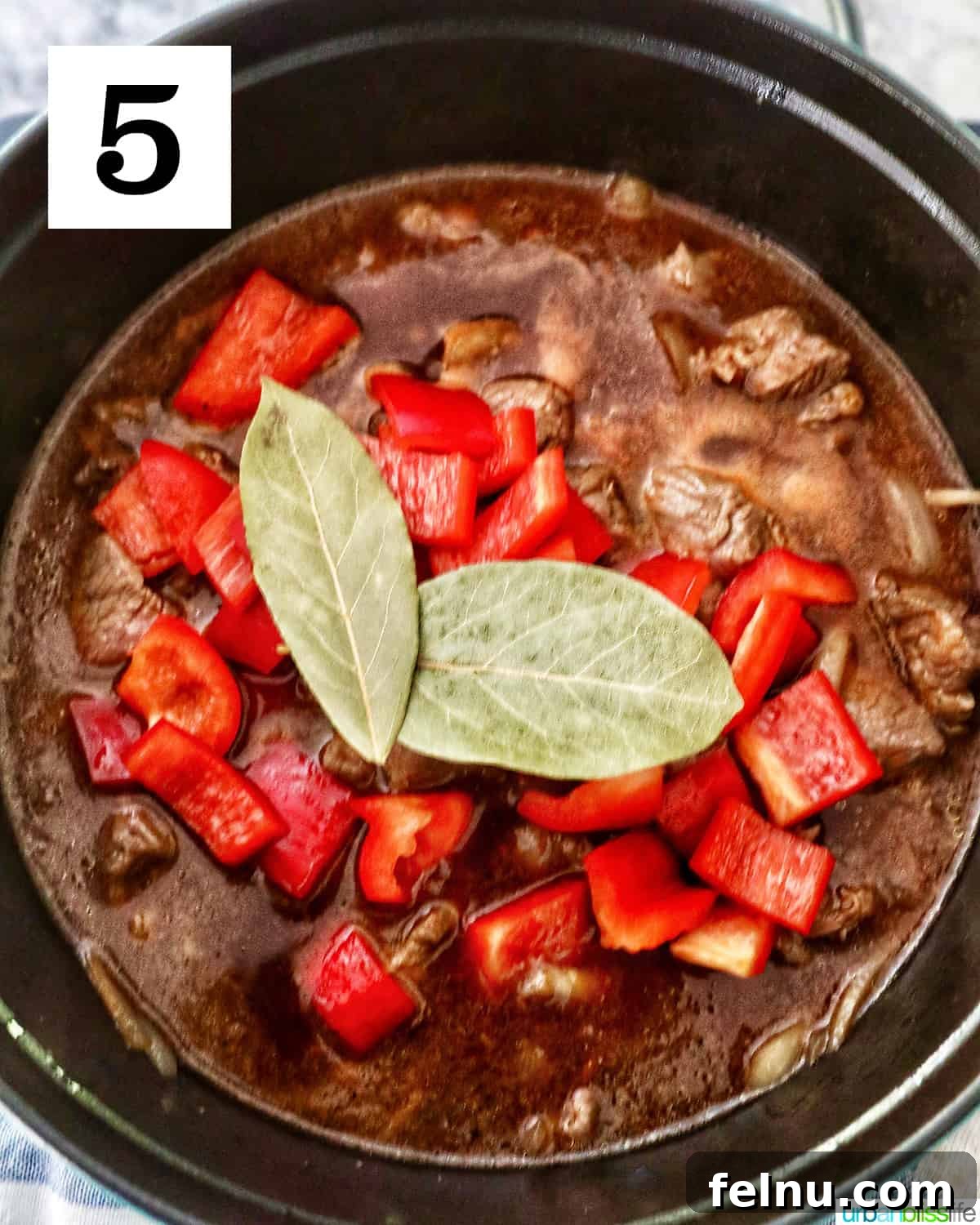Hearty Filipino Beef Stew: Mechado 9 Adding bell pepper and bay leaves