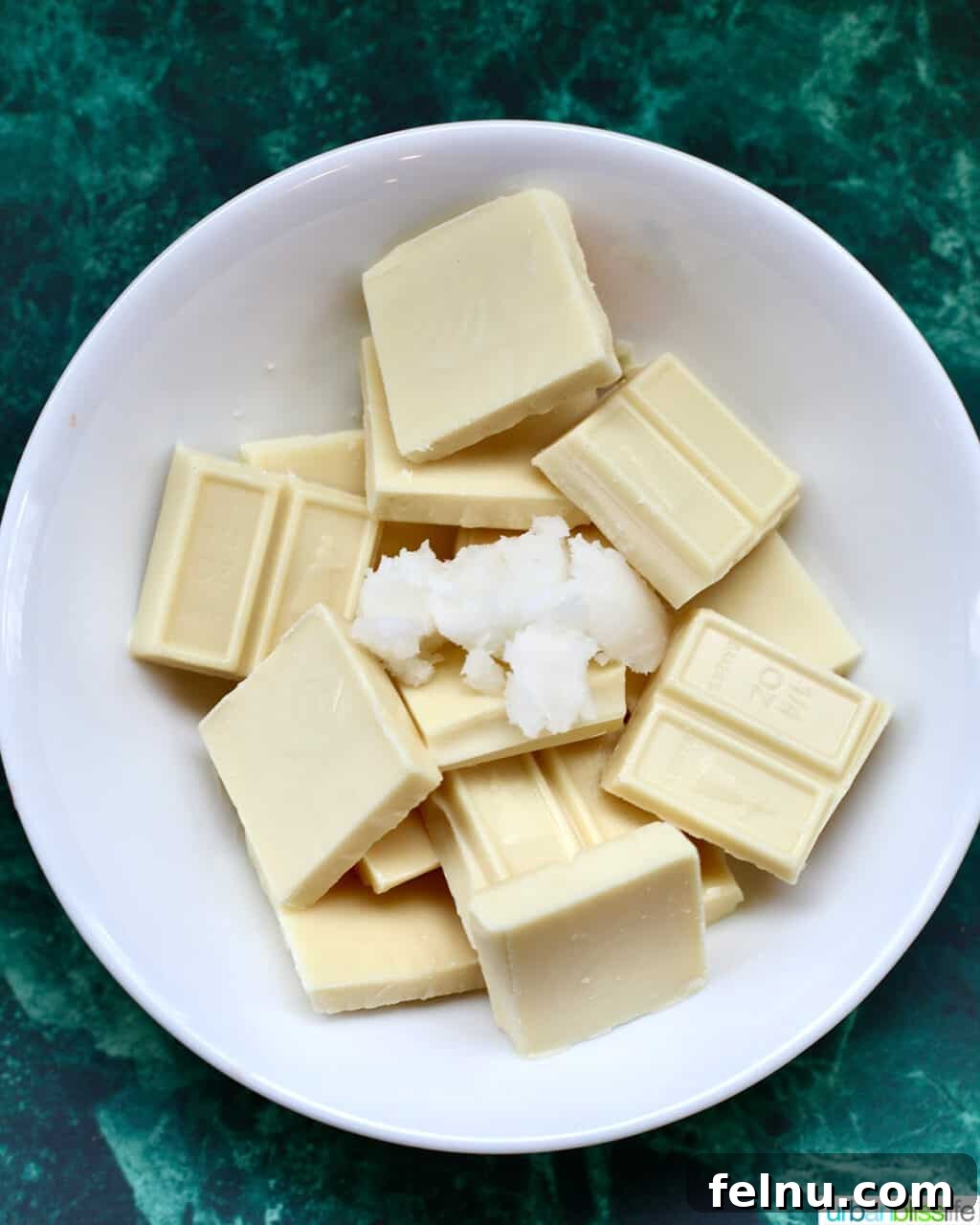 Festive Holiday Popcorn Mix 6 white chocolate and coconut oil in a bowl