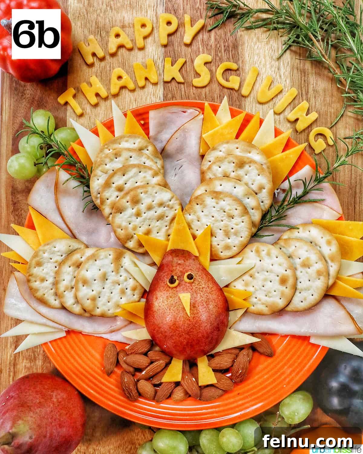 thanksgiving charcuterie board with turkey meat, cheeses, crackers.