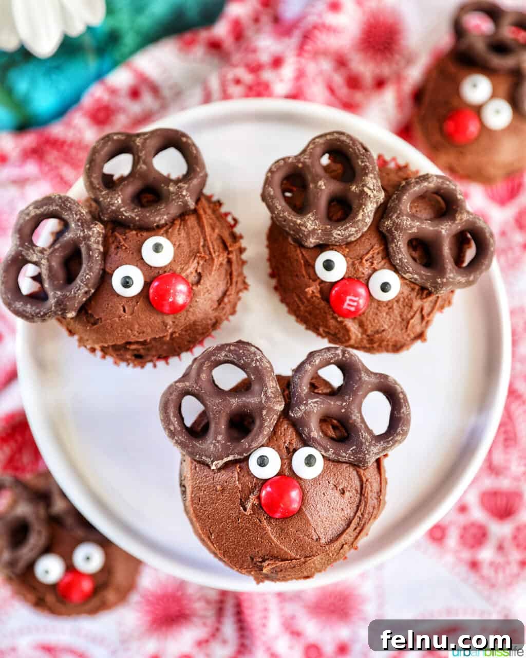 Reindeer Delight Cupcakes 18 Three reindeer cupcakes on a plate, farther away